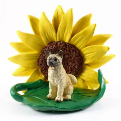 Akita Fawn Figurine Sitting on a Green Leaf in Front of a Yellow Sunflower