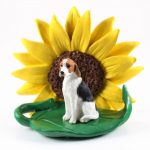 American Fox Hound Figurine Sitting on a Green Leaf in Front of a Yellow Sunflower
