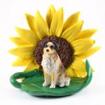 Australian Shepherd Brown Figurine Sitting on a Green Leaf in Front of a Yellow Sunflower