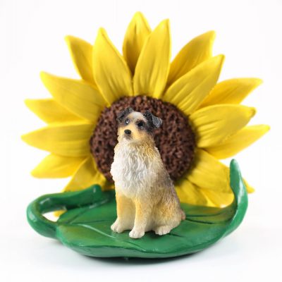 Australian Shepherd Brown Docked Tail Figurine Sitting on a Green Leaf in Front of a Yellow Sunflower
