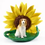 Borzoi Figurine Sitting on a Green Leaf in Front of a Yellow Sunflower