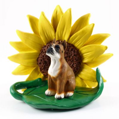 Boxer Figurine Sitting on a Green Leaf in Front of a Yellow Sunflower