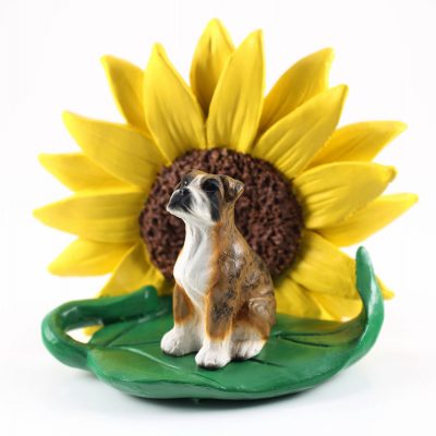 Boxer Brindle Uncropped Figurine Sitting on a Green Leaf in Front of a Yellow Sunflower