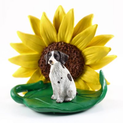 Brittany Liver/White Figurine Sitting on a Green Leaf in Front of a Yellow Sunflower