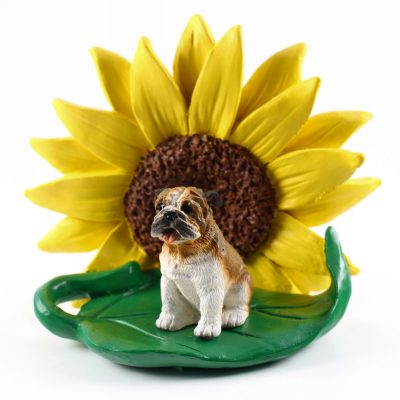 Bulldog Tan/White Figurine Sitting on a Green Leaf in Front of a Yellow Sunflower