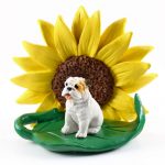Bulldog White Figurine Sitting on a Green Leaf in Front of a Yellow Sunflower
