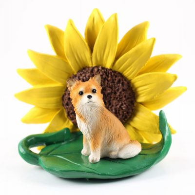 Chihuahua Longhair Figurine Sitting on a Green Leaf in Front of a Yellow Sunflower