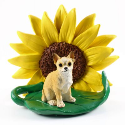 Chihuahua Figurine Sitting on a Green Leaf in Front of a Yellow Sunflower