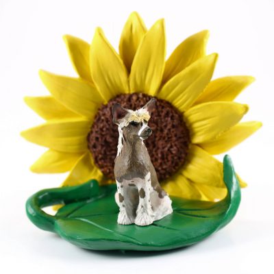 Chinese Crested Figurine Sitting on a Green Leaf in Front of a Yellow Sunflower
