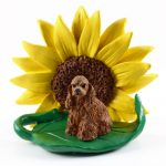 Cocker Spaniel Brown Figurine Sitting on a Green Leaf in Front of a Yellow Sunflower