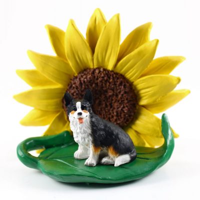 Corgi Cardigan Figurine Sitting on a Green Leaf in Front of a Yellow Sunflower