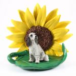 English Setter Blue Figurine Sitting on a Green Leaf in Front of a Yellow Sunflower