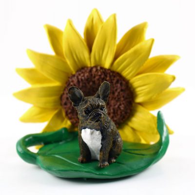 French Bulldog Brindle Figurine Sitting on a Green Leaf in Front of a Yellow Sunflower