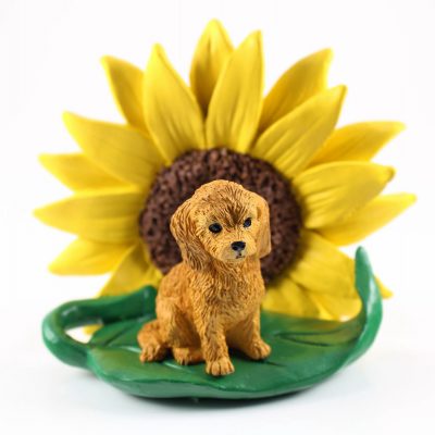 Goldendoodle Figurine Sitting on a Green Leaf in Front of a Yellow Sunflower