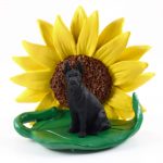 Great Dane Black Figurine Sitting on a Green Leaf in Front of a Yellow Sunflower
