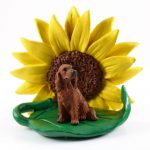 Irish Setter Figurine Sitting on a Green Leaf in Front of a Yellow Sunflower