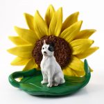 Pitbull White Figurine Sitting on a Green Leaf in Front of a Yellow Sunflower