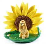 Poodle Apricot Figurine Sitting on a Green Leaf in Front of a Yellow Sunflower