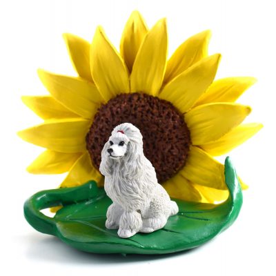 Poodle White Figurine Sitting on a Green Leaf in Front of a Yellow Sunflower