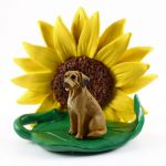 Rhodesian Ridgeback Figurine Sitting on a Green Leaf in Front of a Yellow Sunflower