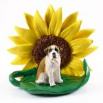 Saint Bernad Smooth Coat Figurine Sitting on a Green Leaf in Front of a Yellow Sunflower