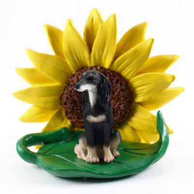 Saluki Figurine Sitting on a Green Leaf in Front of a Yellow Sunflower