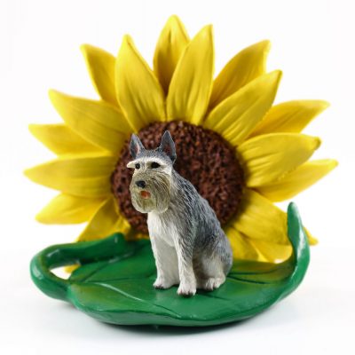 Schnauzer Gray Giant Figurine Sitting on a Green Leaf in Front of a Yellow Sunflower