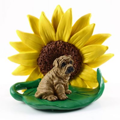 Shar Pei Brown Figurine Sitting on a Green Leaf in Front of a Yellow Sunflower
