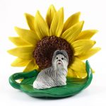 Shih Tzu Gray Figurine Sitting on a Green Leaf in Front of a Yellow Sunflower