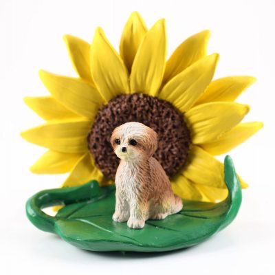 Shih Tzu Tan Puppy Cut Figurine Sitting on a Green Leaf in Front of a Yellow Sunflower