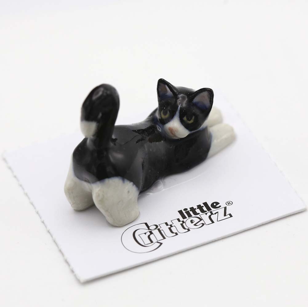 stuffed black and white cat