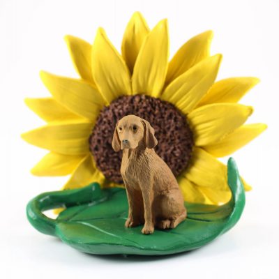 Vizsla Figurine Sitting on a Green Leaf in Front of a Yellow Sunflower