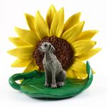 Weimaraner Figurine Sitting on a Green Leaf in Front of a Yellow Sunflower