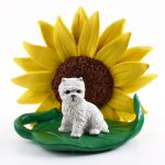 Westie Figurine Sitting on a Green Leaf in front of a Yellow Sunflower