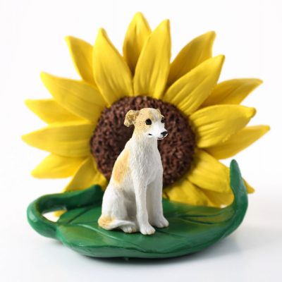 Whippet Tan Figurine Sitting on a Green Leaf in front of a Yellow Sunflower